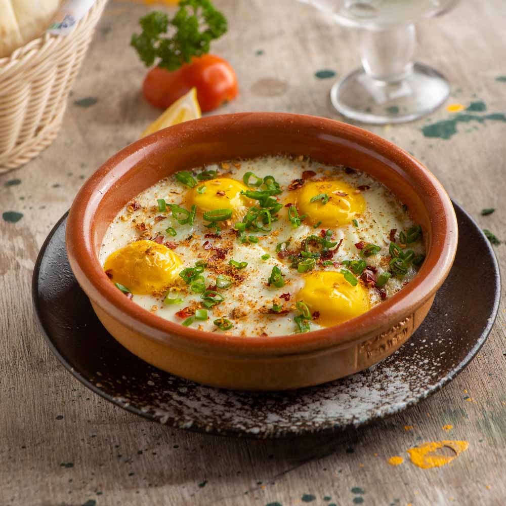Eggs with a clay pot on top