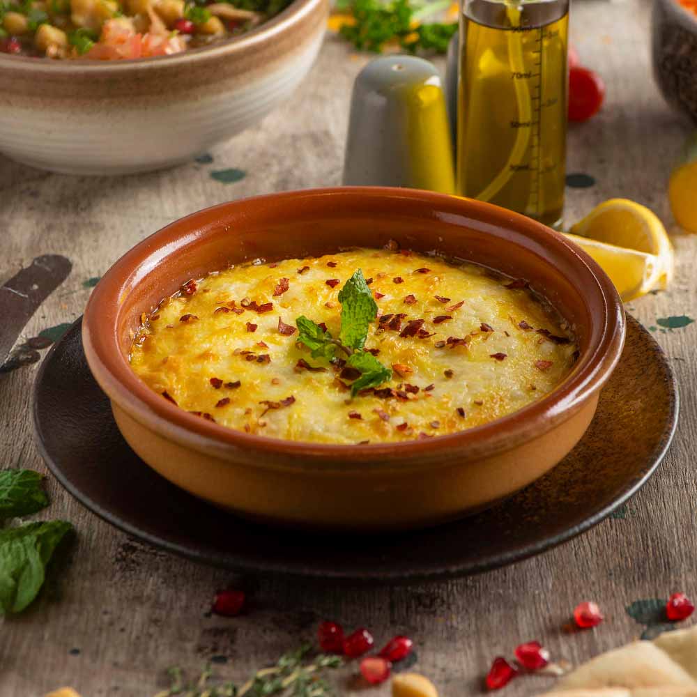 Cheese omelet in a clay pot